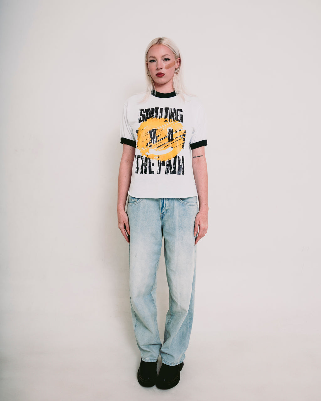 SMILING THROUGH THE PAIN ringer t-shirt