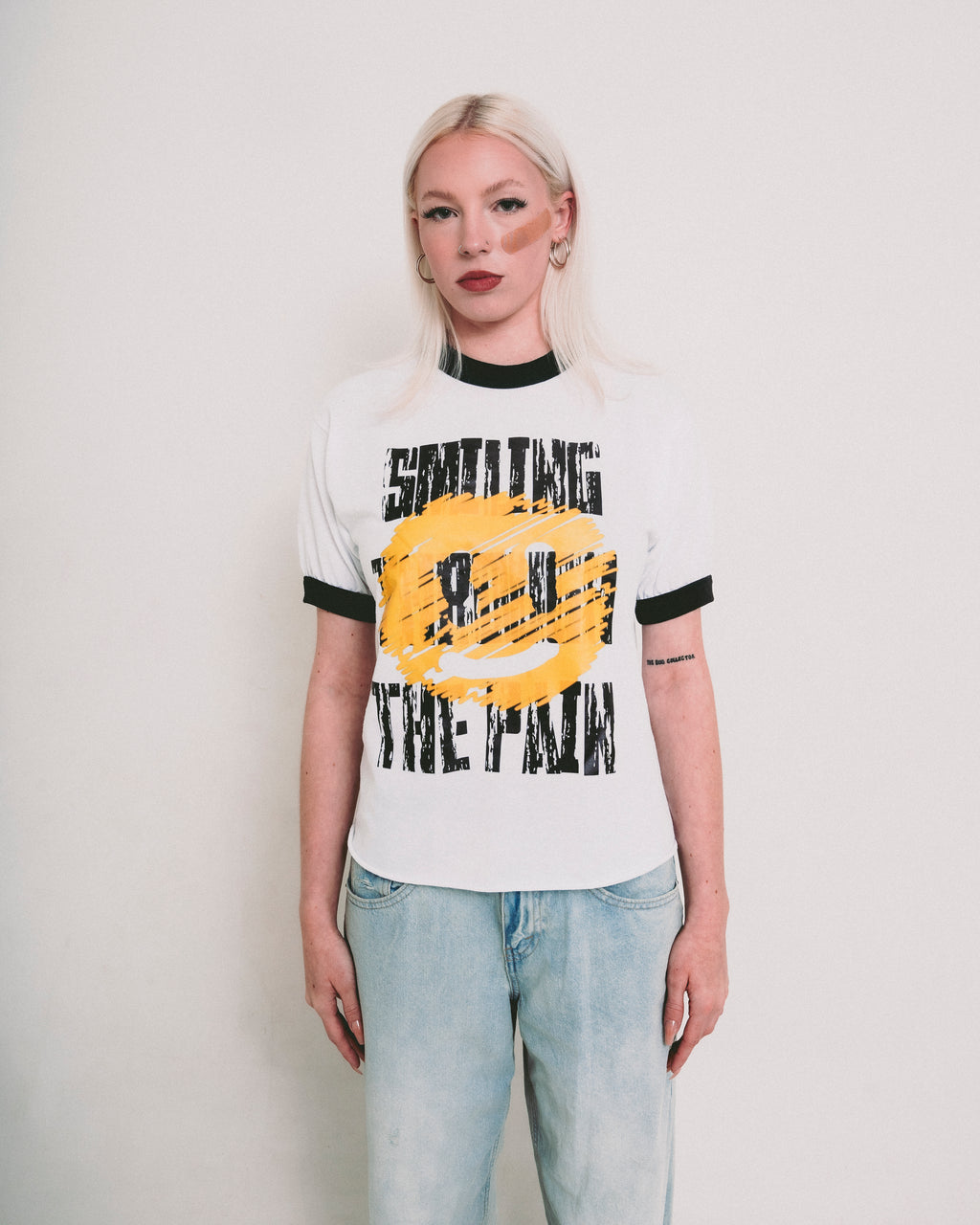 SMILING THROUGH THE PAIN ringer t-shirt