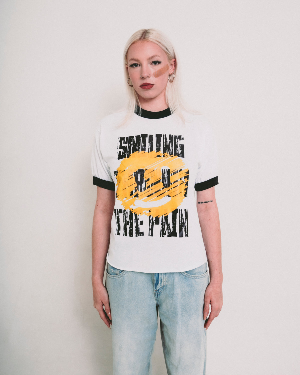 SMILING THROUGH THE PAIN ringer t-shirt